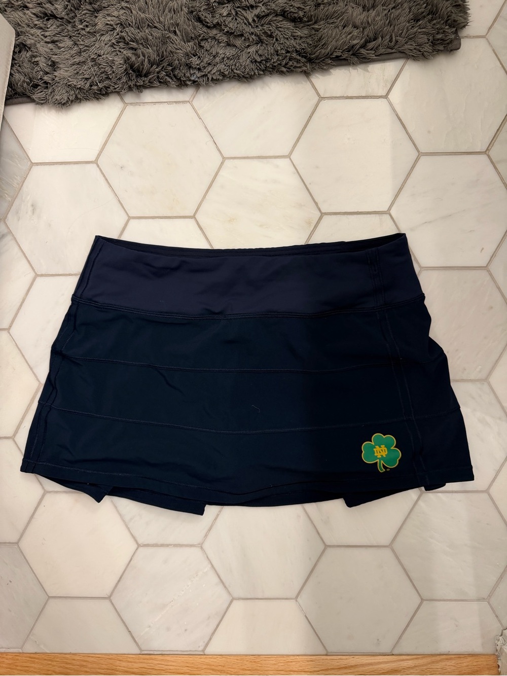 Lululemon athletica navy blue tennis skirt with Notre Dame logo